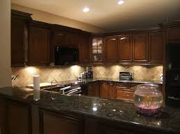 It's done to maximize the charm of the granite pattern. Picture Of Light Kitchen Backsplashes With Cherry Cabinets And Dark Granite Countertops