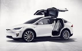 Tesla model x black satin gold dust vinyl wrap with carbon fiber accents on chrome and all 6 seat backs. First Drive Review 2016 Tesla Model X P90d