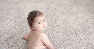 baby with diapers crawling on the