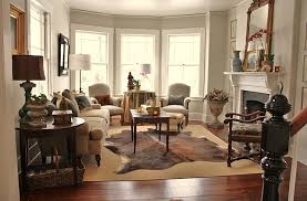 cowhide rugs hanging with the