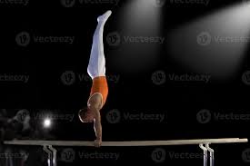 male gymnast performing handstand on