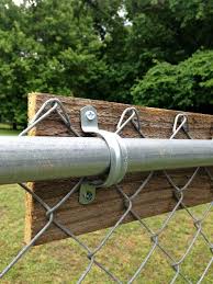 To tighten the chain link, insert a tension bar about 3 feet to the end and hook the stretcher bar there. Upgrading A Chain Link Fence Diy Garden Fence Backyard Fences Fence Design