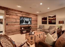 The basement family room should be a in a very large basement, consider wallpaper on one wall and paint on the others to break up the space. Home Design Plans Warm Basement Ideas