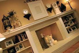 long mantle fireplace bookshelves