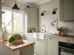 sage green kitchen cabinets in a green