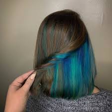 Flaunt black hair with blue highlights and get a unique dimensional color! 20 Pretty Peekaboo Highlights You Need To See Now