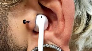 headphones with a tragus piercing