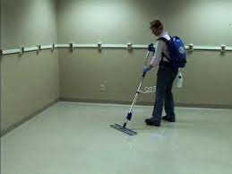 ecolab applying floor finish with