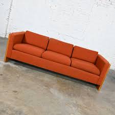 burnt orange tuxedo style sofa
