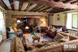 a cosy cottage living room with a log