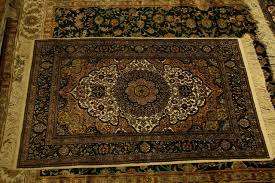 difference between a carpet and a rug