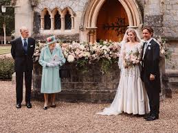 The queen and prince philip are sitting on chairs in front of them. Princess Beatrice Wedding Details You Missed From Secret Ceremony