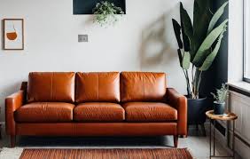 living room have orange leather sofa