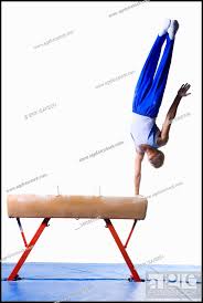 male gymnast performing routines on