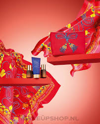 patterned red makeup bag with cosmetics