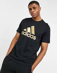 Adidas partners with the better cotton initiative to improve livelihoods of cotton producers and reduce the environmental impact of cotton production. Adidas T Shirt In Black With Gold Logo Asos