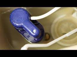adjusting a toilet fill valve you