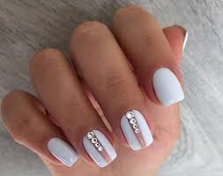 Here are 22 different designs you can try that will catch anyone's attention in the office! Nails In White Gel A Range Of Ideas To Adopt A Very Chic Winter Nail Art Women Style Tips White Gel Nails Elegant Nails Elegant Nail Designs