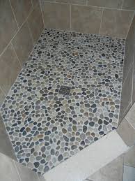 bathroom with a pebble shower floor