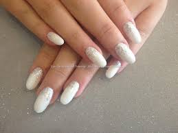 Try a clear nail with red and white painted curlicues or petals. Acrylic White And Silver Glitter Nails Nail And Manicure Trends
