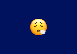 face exhaling emoji meaning