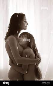 Mother and 8 year old daughter together hugging Stock Photo - Alamy