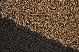 homemade crochet rag rug that curls up
