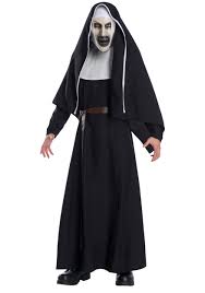 Features a black habit with long sleeves and a black cloak with. The Nun Deluxe Adult Costume