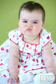 baby with funny face stock photo