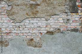 Weathered Grungy Broken Brick Wall