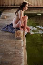 Naked Woman Sitting At The Edge Of Japanese Spa And Hot Springs by Stocksy  Contributor Trinette Reed - Stocksy