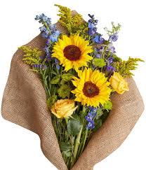 Take one look at a gathering of sunflowers and it's not hard to see why these flowers attract so much attention. Sapphire And Sunflowers At From You Flowers