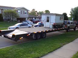 camper on a flatbed trailer