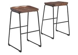 Available in styles ranging from classic to contemporary, our counter stool and barstool designs make it easy to find pieces that match your existing furniture. Showdell Pub Height Bar Stool Ashley Furniture Homestore Independently Owned And Operated By Homemart Sociedad Anonima