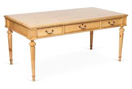 Tapering, fluted legs lend it the airy expansiveness of the traditional library tables upon which the earliest partner's desks were based. French Writing Desk For Sale Cottage Bungalow