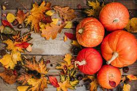 Pumpkins with fall leaves over wooden background. Orange halloween pumpkins in autumm composition. 8106540 Stock Photo at Vecteezy