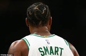 Boston celtics guard marcus smart grabs for his left leg after being injured against the los angeles lakers. Nba Star Marcus Smart Has Shamrock Woven Into His Hair Daily Mail Online