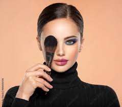 cosmetic brush at face woman covering