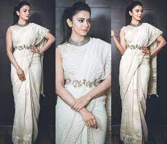 Wearing the lehenga saree style has been in trend for a long time now, but this year in 2020 wear a kammar bandh or waist belt chain over your saree to get the complete look. Rakul Preet In A Ivory Colour Party Wear Saree With Belt