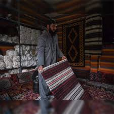 afghan families go back to making