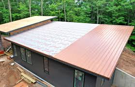 can you put a metal roof over shingles