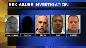 authorities charge 5 more in probe of