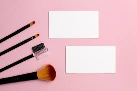 makeup brush and white business card