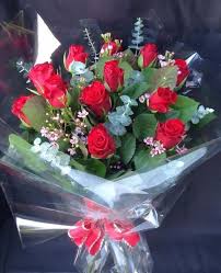 red roses bouquet by lovely blooms