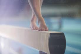 bare feet of female gymnast performing