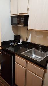 Microwave fridge cabinet incorporate the latest advances in technology to foster better outputs and efficiency. Storage Space Cabinets Microwave Oven Sink And Mini Fridge Area Picture Of Clarion Inn Suites West Chase Houston Tripadvisor