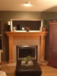 fireplace mantle with a window over