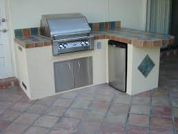 These outdoor kitchen packages are designed for quick and easy setup. What Kind Of Base Design Is This Interesting Outdoor Grill Tile Counter More Outdoor Kitchen Small Outdoor Kitchens Kitchen Built In Outdoor Kitchen Grill