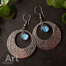 large round earrings with blue stones