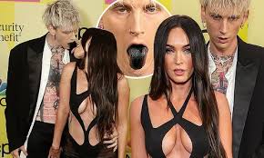 Megan fox appears visibly irritated and displeased with boyfriend machine gun kelly at the billboard music awards in los angeles despite the couple putting on a loved up pda display on the red carpet for the event. P7wpwjp479flxm